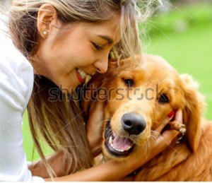 Happy owner smiling with her well-mannered dog